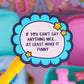 A close-up of a round scalloped sticker or label on a yellow stick, reading 'IF YOU CAN'T SAY ANYTHING NICE.
