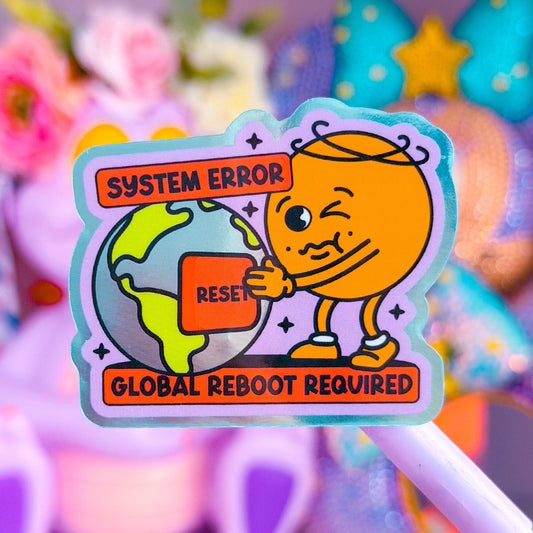 A colorful cartoon sticker or pin featuring an orange character winking while holding a globe, with text reading 'SYSTEM ERROR' and 'GLOBAL REBOOT REQUIRED', shown against a soft blurred pastel background.