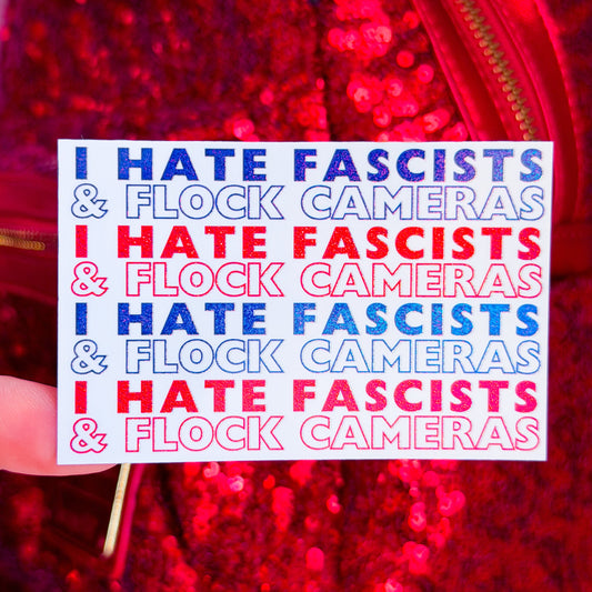 A hand holds a white sticker with the text 'I HATE FASCISTS & FLOCK CAMERAS' repeated in blue and red, set against a red sequined background.